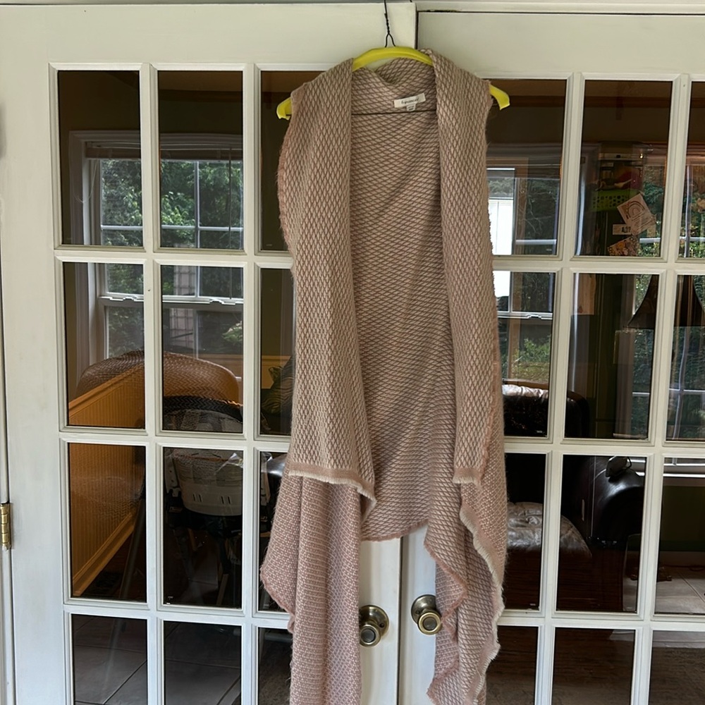 This cardigan has been wore twice. Is a rose gold and cream color.